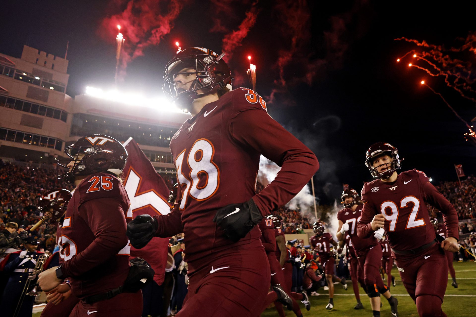 The Virginia Tech Hokies runs onto the field during “Enter Sandman” before playing against the Virginia Cavaliers at Lane Stadium.