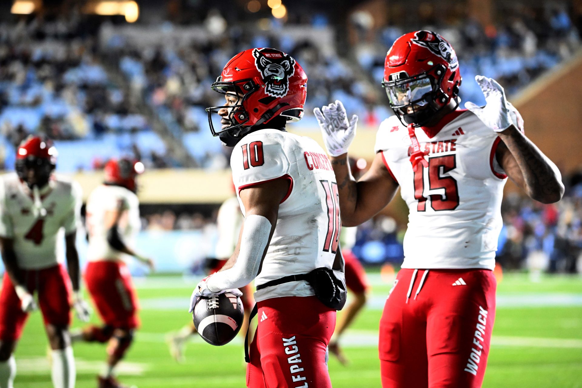 North Carolina State Wolfpack wide receiver Kevin Concepcion (10) celebrates with North Carolina State Wolfpack tight end Justin Joly (15) after scoring a touchdown in the fourth quarter at Kenan Memorial Stadium.