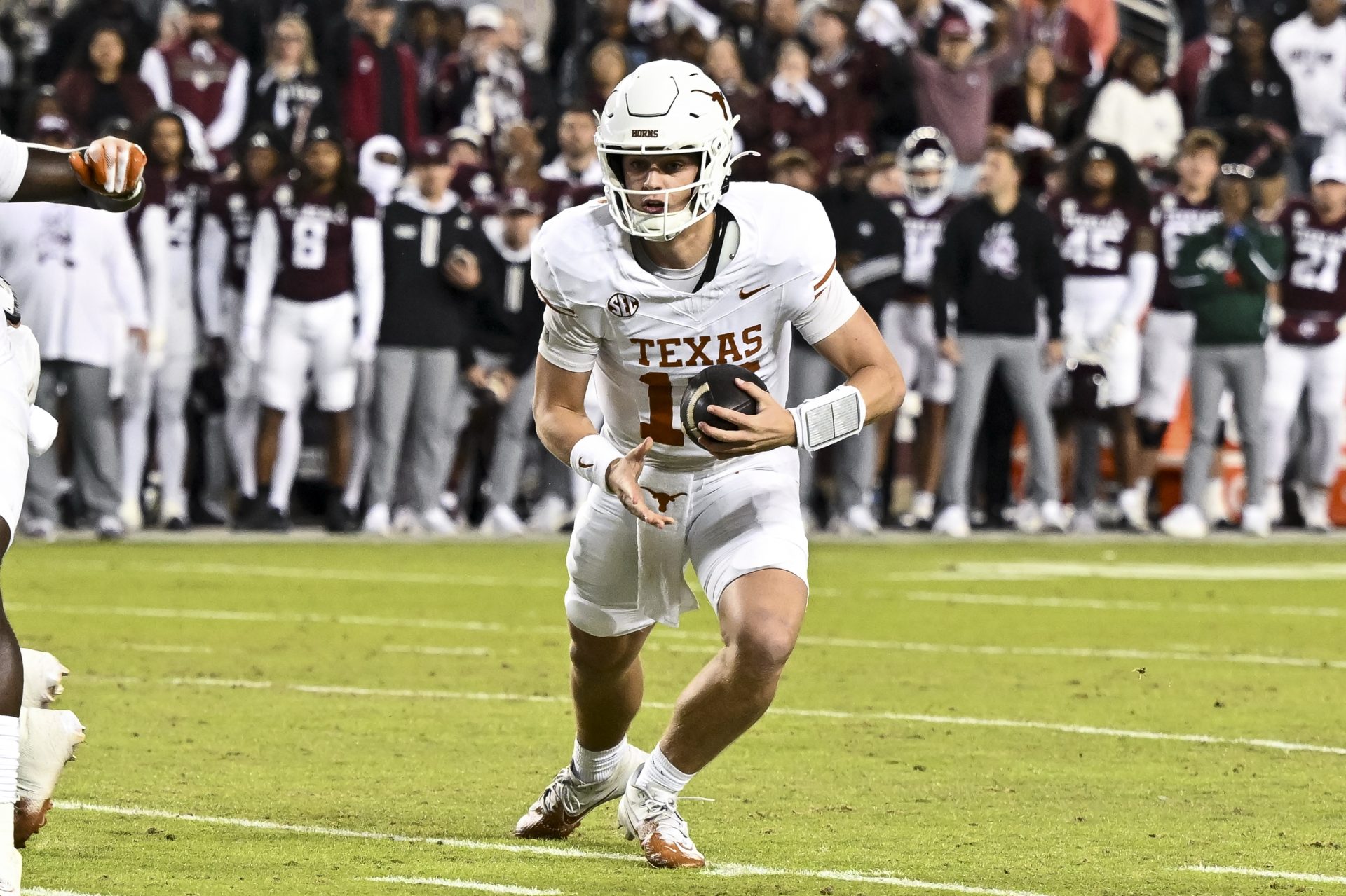 Texas Longhorns quarterback Arch Manning (16) runs the ball during the first quarter against the Texas A&M Aggies. The Longhorns defeated the Aggies 17-7 at Kyle Field.