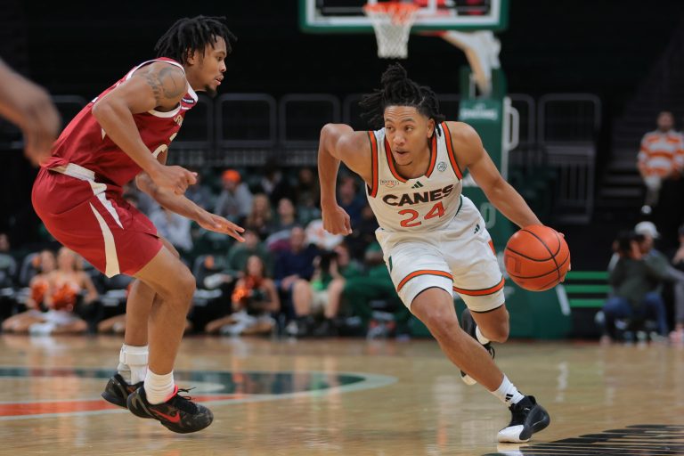Miami Hurricanes guard Nijel Pack (24) drives to the basket past Arkansas Razorbacks guard D.J. Wagner (21) during the second half at Watsco Center.