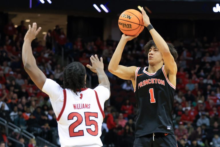 Princeton Tigers guard Xaivian Lee (1) shoots a three point basket while being guarded by Rutgers Scarlet Knights guard Jeremiah Williams (25) during the second half at Prudential Center.