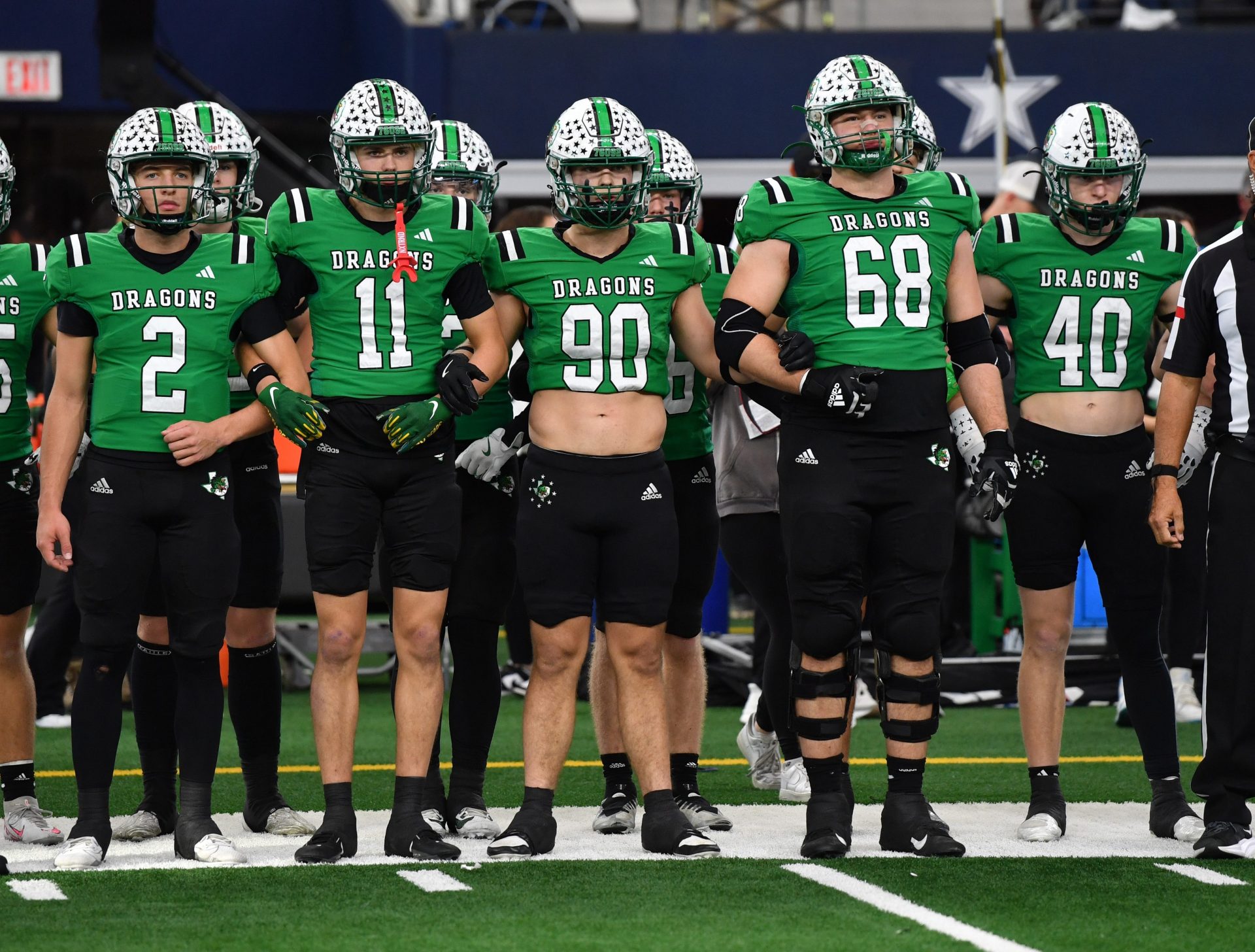 Southlake Carroll's captains walk to mid-field during the 6A DII UIL Texas State Football Championship game against Austin Vandegrift on Saturday, December 21, 2024 at AT&T Stadium in Arlington.