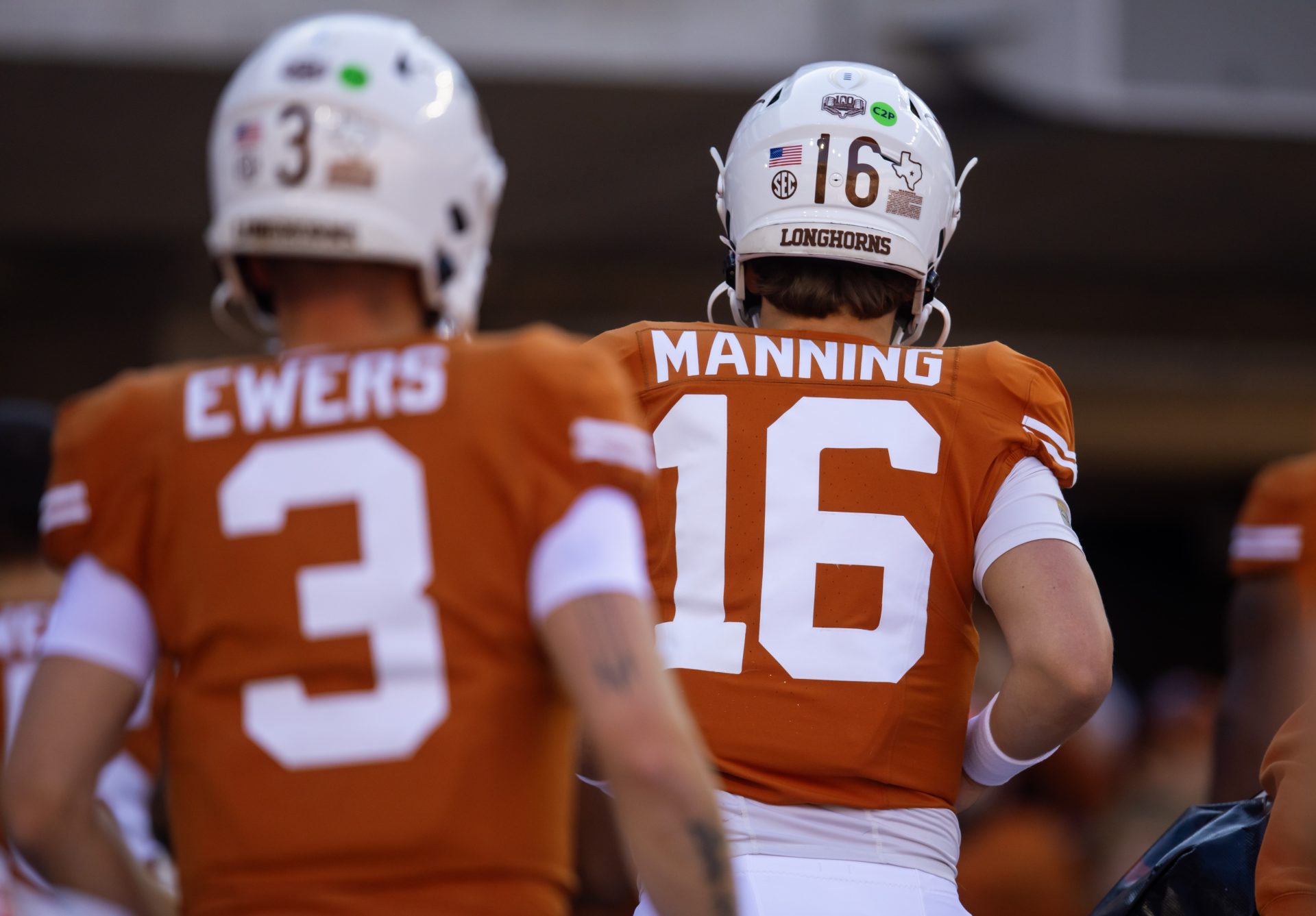 Texas Longhorns quarterback Arch Manning (16) and Quinn Ewers (3) against the Clemson Tigers during the CFP National playoff first round at Darrell K Royal-Texas Memorial Stadium.