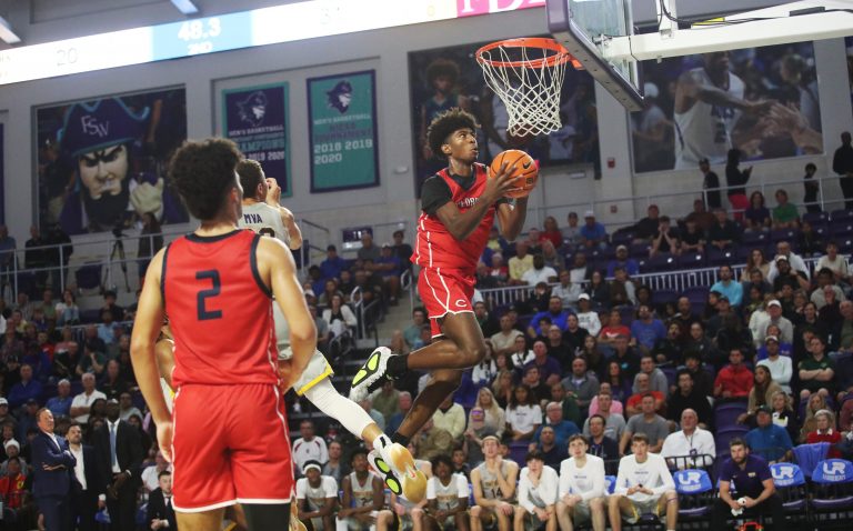 Jaxon Richardson of the Miami Columbus High School basketball team drives to the basket during the championship game against Montverde at the City of Palms Classic at Suncoast Credit Union Arena in Fort Myers