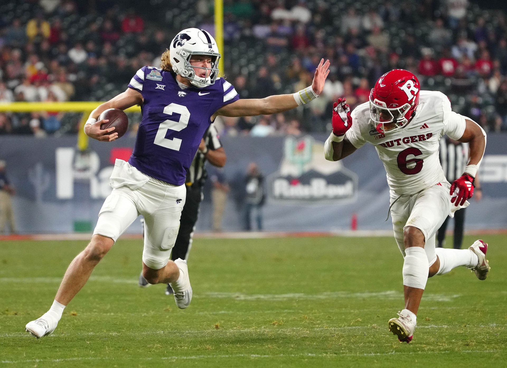 Kansas State quarterback Avery Johnson (2) scrambles against Rutgers during second half of the Rate Bowl at Chase Field on Dec. 26, 2024, in Phoenix.