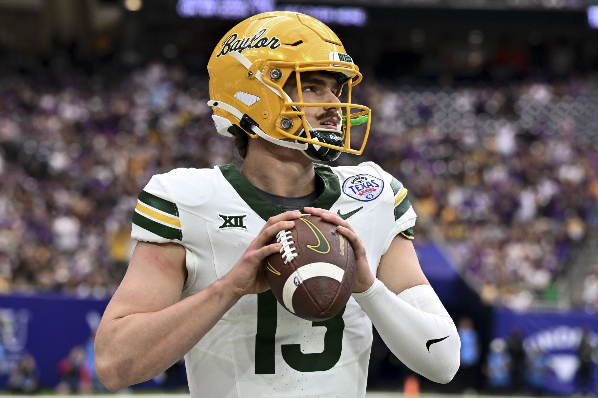 Baylor Bears quarterback Sawyer Robertson (13) warms up on the sideline during the first half against the LSU Tigers at NRG Stadium.