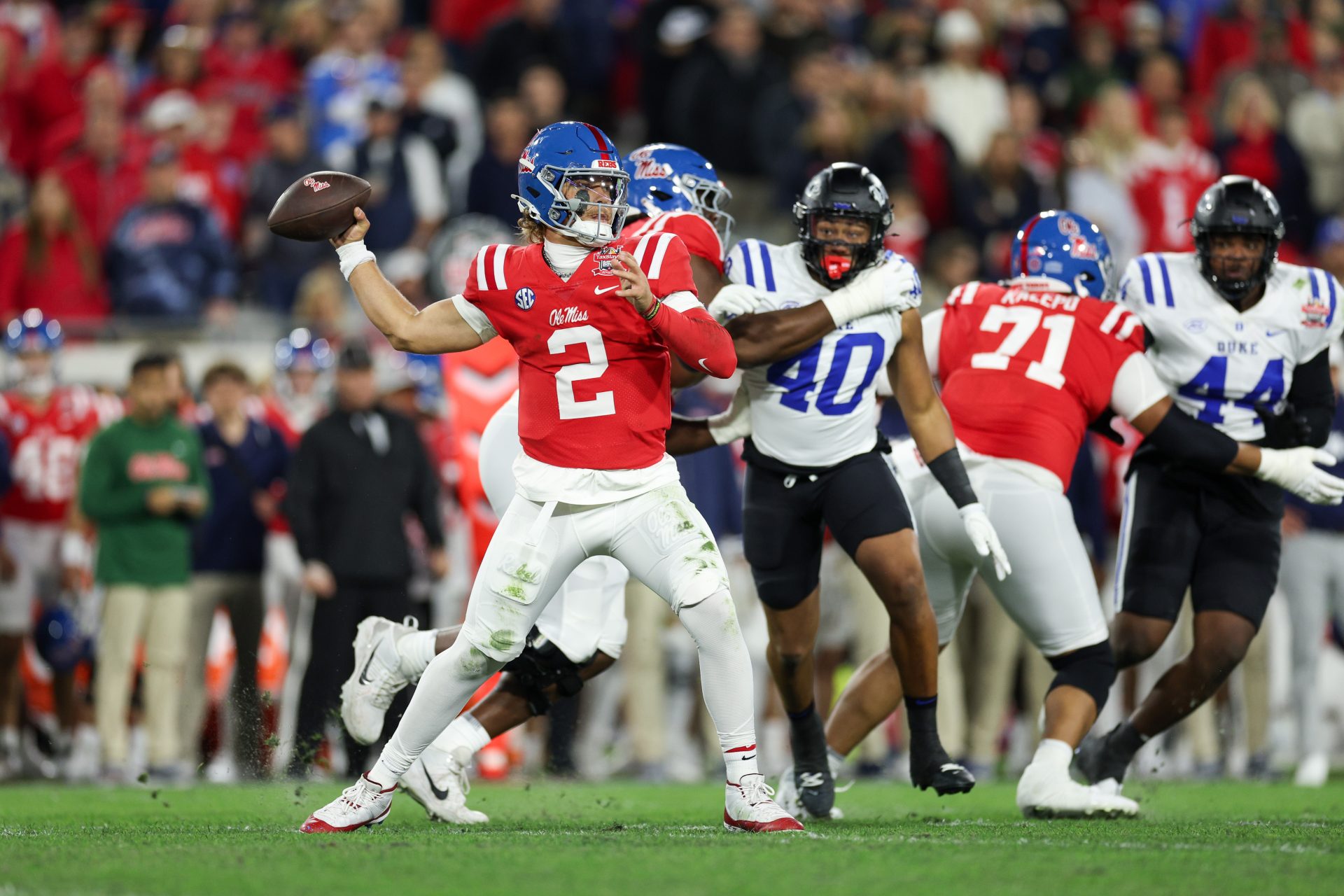 Mississippi Rebels quarterback Jaxson Dart (2) drops back to pass against the Duke Blue Devils in the first quarter during the Gator Bowl at EverBank Stadium.