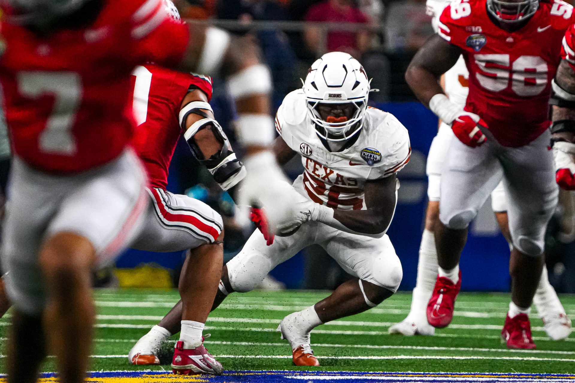 Texas Longhorns running back Quintrevion Wisner (26) runs the ball during the College Football Playoff semifinal game against Ohio State in the Cotton Bowl at AT&T Stadium on Friday, Jan. 10, 2024 in Arlington, Texas.