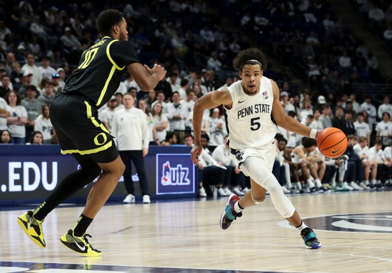 Penn State Nittany Lions guard/forward Puff Johnson (5) dribbles the ball towards the basket as Oregon Ducks forward Kwame Evans Jr (10) defends during the first half at Bryce Jordan Center.