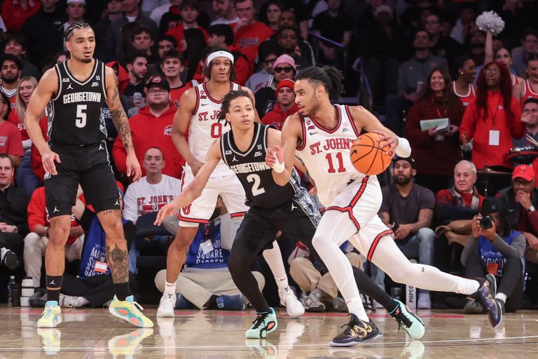 St. John's Red Storm guard Jaiden Glover (11) drives past Georgetown Hoyas guard Malik Mack (2) in the second half at Madison Square Garden.