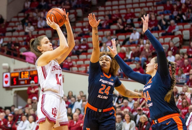 Indiana's Yarden Garzon (12) shoots over Illinois' Adalia McKenzie (24) and Kendall Bostic (44) during the Indiana versus Illinois women's basketball game at Simon Skjodt Assembly Hall on Thursday, Jan. 16, 2025.
