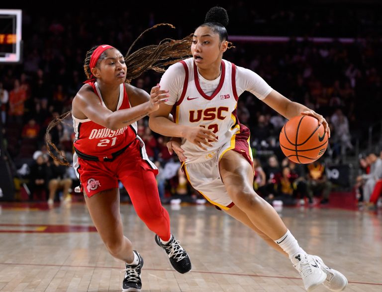 USC Trojans guard JuJu Watkins (12) drives to the basket as Ohio State Buckeyes guard Chance Gray (21) tries to defend during the fourth quarter at Galen Center.