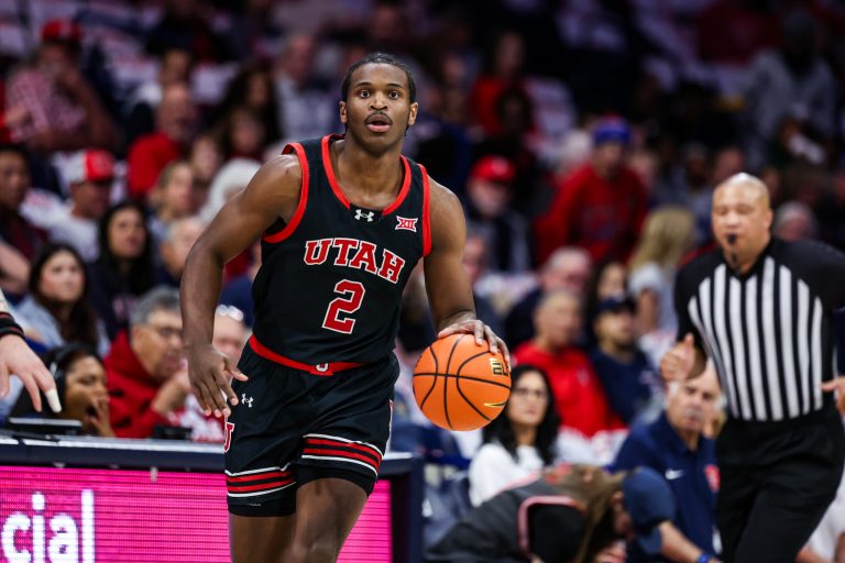 Utah Utes forward Ezra Ausar (2) dribbles the ball during the first half against the Arizona Wildcats at McKale Center.