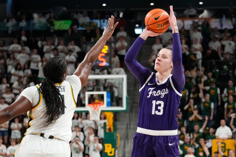 TCU Horned Frogs center Sedona Prince (13) scores a basket againt Baylor Lady Bears center Aaronette Vonleh (21) during the first half at Paul and Alejandra Foster Pavilion.