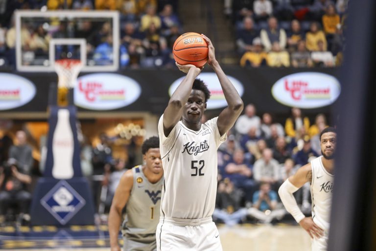 West Virginia, USA; UCF Knights center Moustapha Thiam (52) shoots a free throw during the second half .a2. at WVU Coliseum.