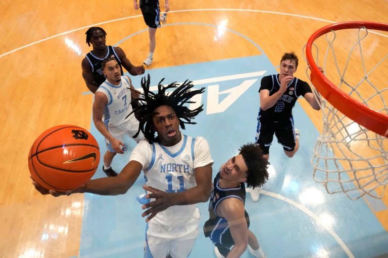 North Carolina Tar Heels guard Ian Jackson (11) shoots as Duke Blue Devils guard Tyrese Proctor (5) defends in the second half at Dean E. Smith Center.