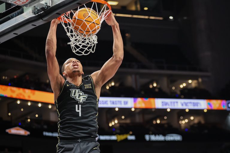 UCF's leading scorer, Keyshawn Hall, commits to Auburn, bringing his dynamic playstyle to the Tigers and setting sights on future NBA aspirations.