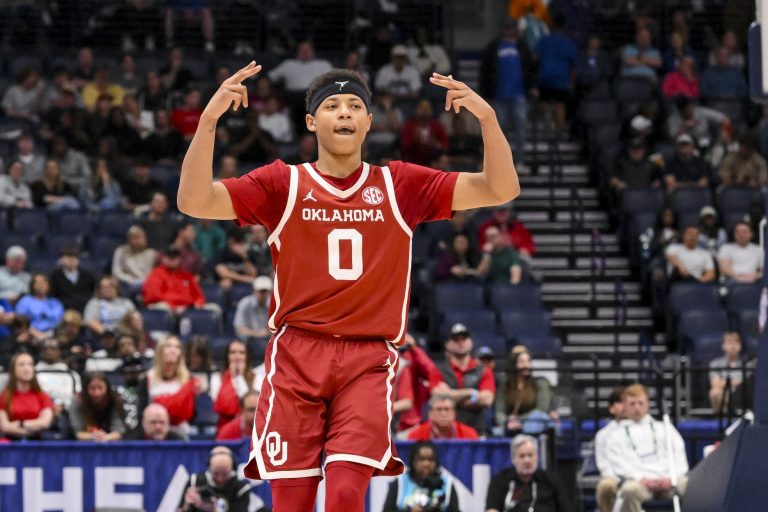 Oklahoma Sooners guard Jeremiah Fears (0) reacts after a three point basket against the Georgia Bulldogs during the second half at Bridgestone Arena.