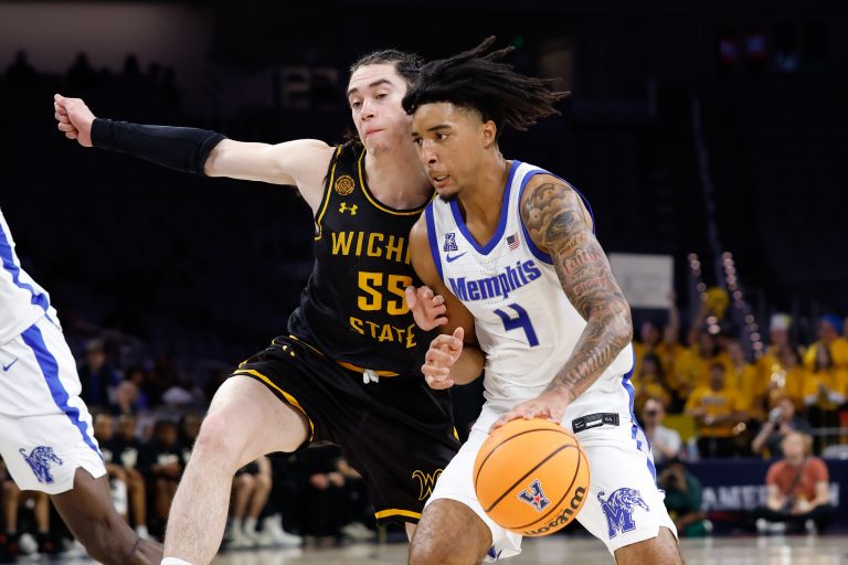 Memphis Tigers guard PJ Haggerty (4) drives to the basket as Wichita State Shockers guard Bijan Cortes (55) defends during the second half at Dickies Arena.
