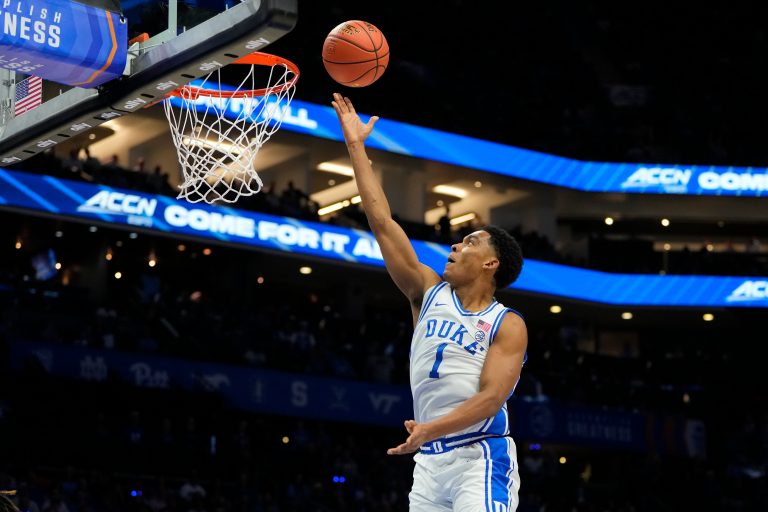 Duke Blue Devils guard Caleb Foster (1) scores in the first half at Spectrum Center.