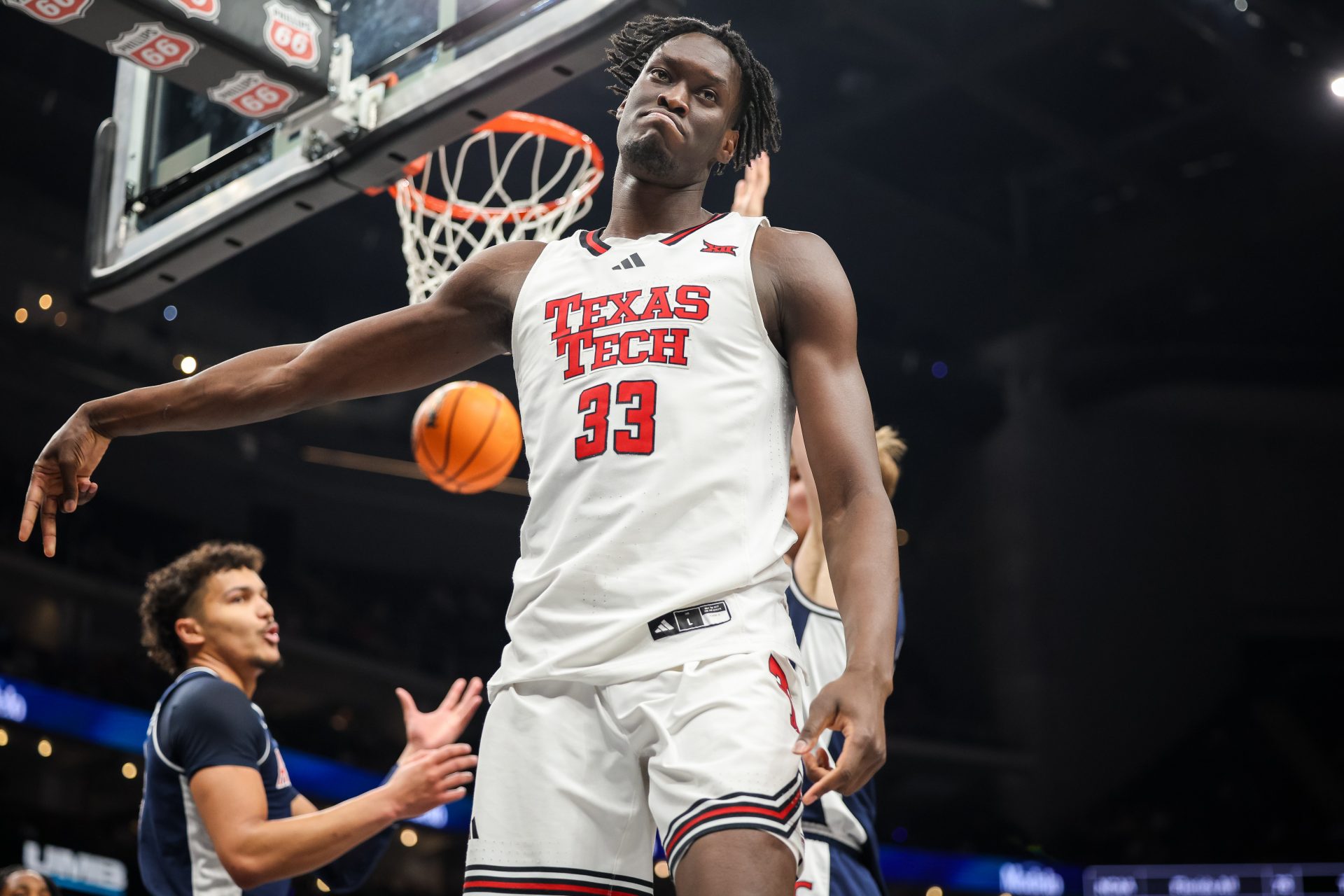 Texas Tech Red Raiders forward Federiko Federiko (33) reacts after a basket during the first half against the Arizona Wildcats at T-Mobile Center.