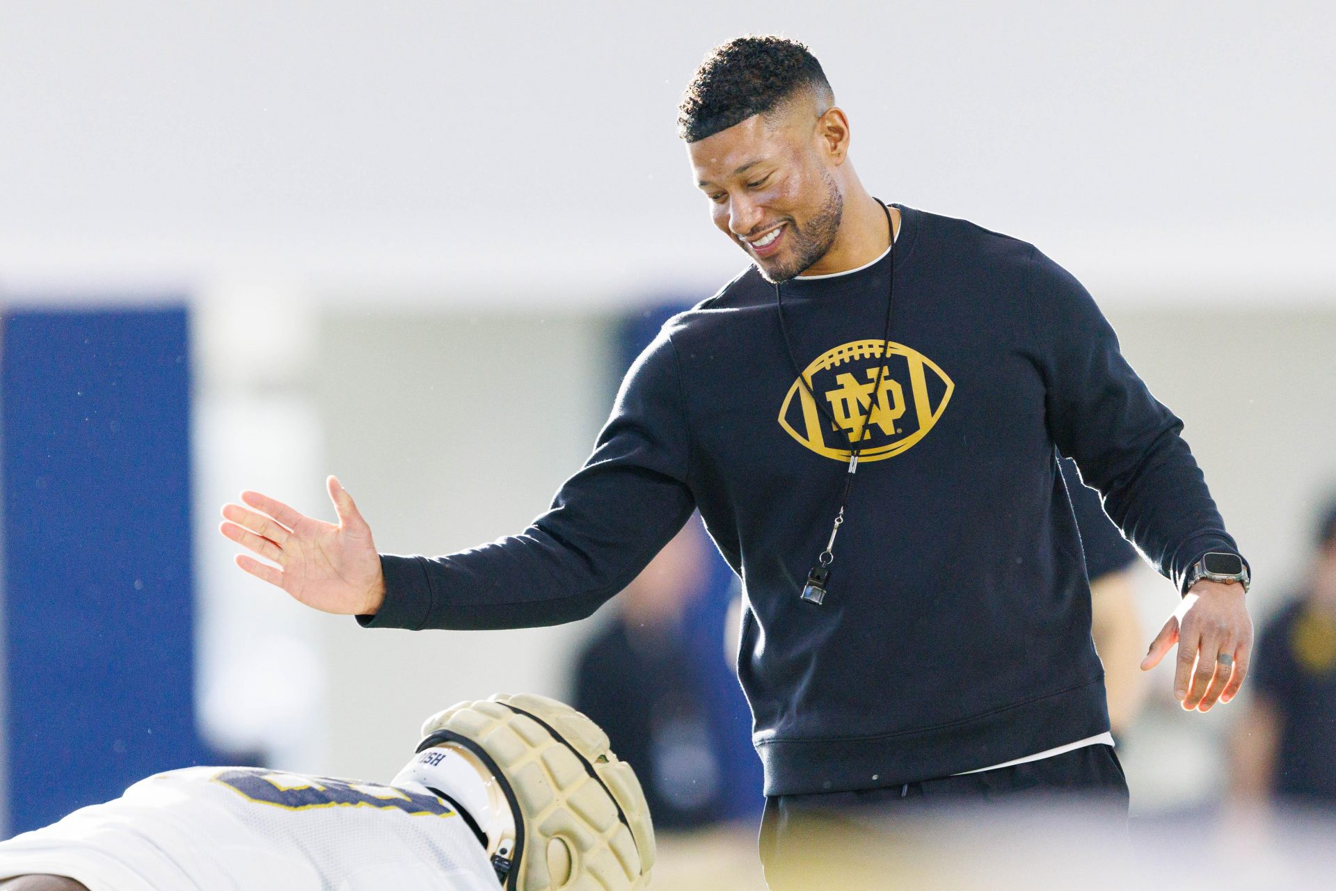 Notre Dame head coach Marcus Freeman greets his players during a Notre Dame football spring practice at Irish Athletic Center