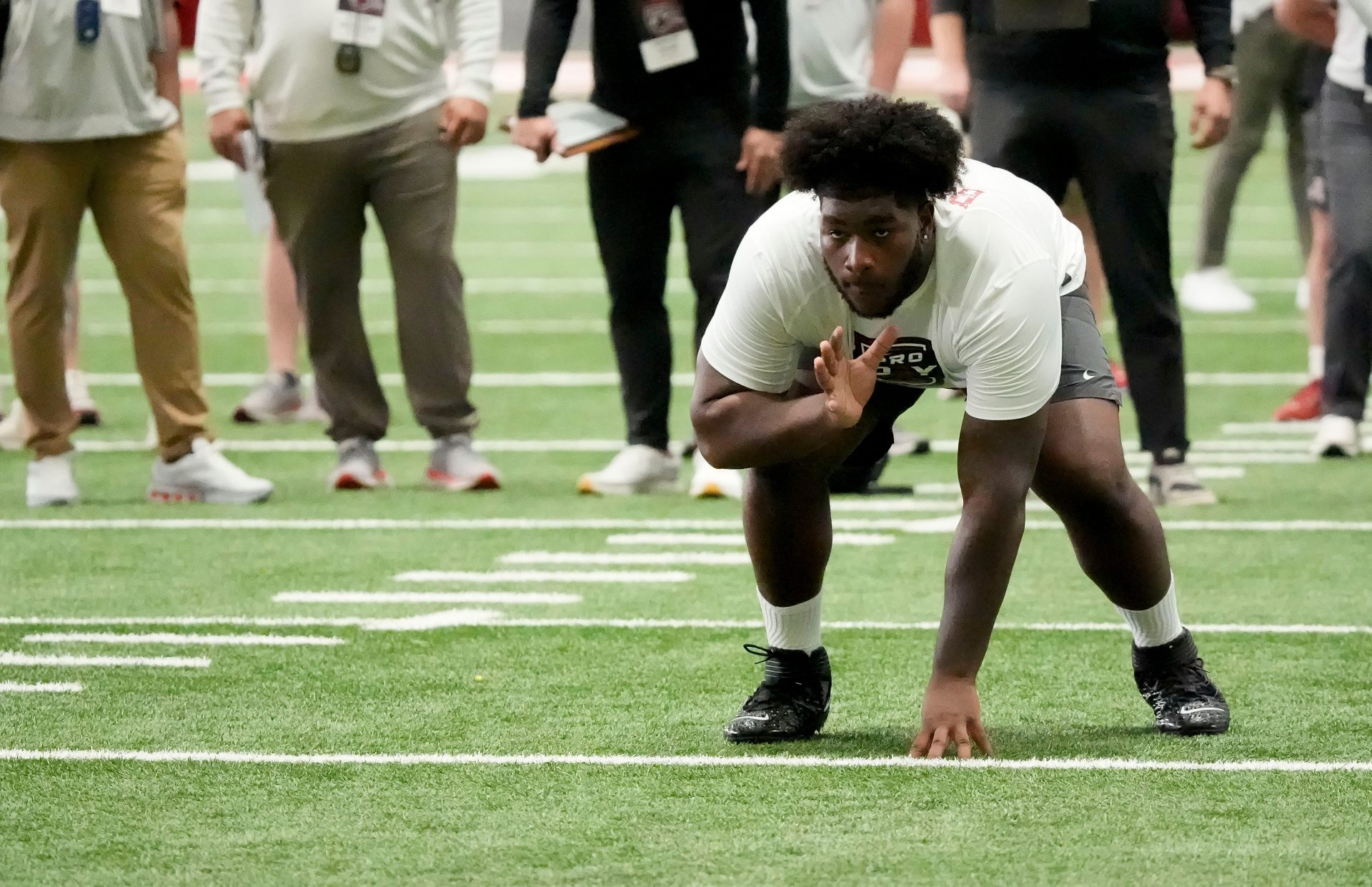 Offensive lineman Tyler Booker rusn a drill for scouts at the University of Alabama Pro Day as several Crimson Tide players worked out for NFL teams in the Hank Crisp Indoor Practice Facility.