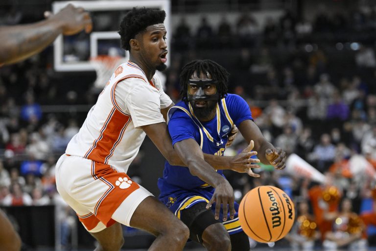 McNeese State Cowboys guard Javohn Garcia (6) passes the ball against Clemson Tigers forward Chauncey Wiggins (7) during the second half at Amica Mutual Pavilion.