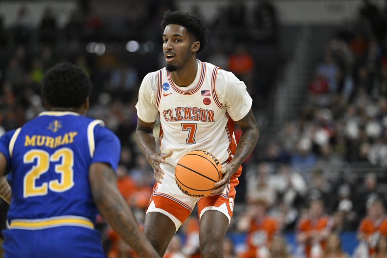 Clemson Tigers forward Chauncey Wiggins (7) controls the ball against McNeese State Cowboys guard Brandon Murray (23) during the first half at Amica Mutual Pavilion.