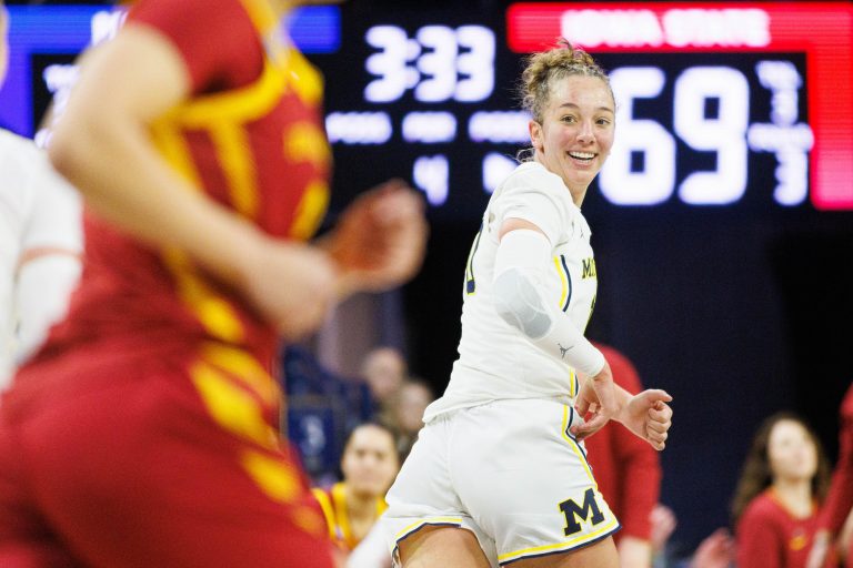 Michigan guard Jordan Hobbs, right, gets back on defense during the first round of the NCAA Women's Basketball Tournament between Michigan
