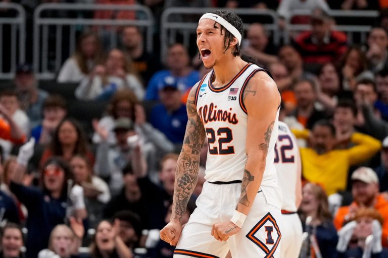 Illinois Fighting Illini guard Tre White (22) celebrates after sinking a three point basket in the second half of the NCAA Tournament First Round game between the Illinois Fighting Illini and the Xavier Musketeers