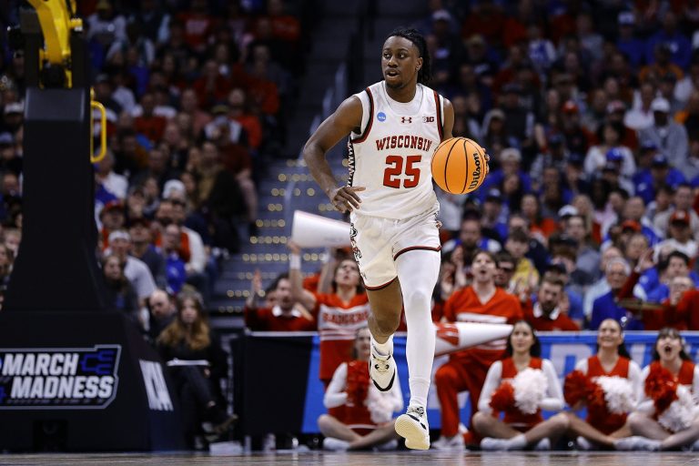 Wisconsin Badgers guard John Blackwell (25) dribbles the ball against the Brigham Young Cougars during the first half in the second round of the NCAA Tournament