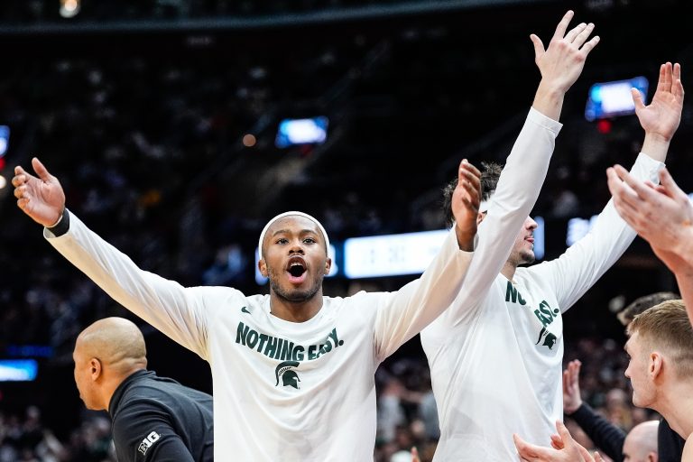 Michigan State guard Tre Holloman (5) celebrates a play against New Mexico during the second half of the Second Round of NCAA tournament