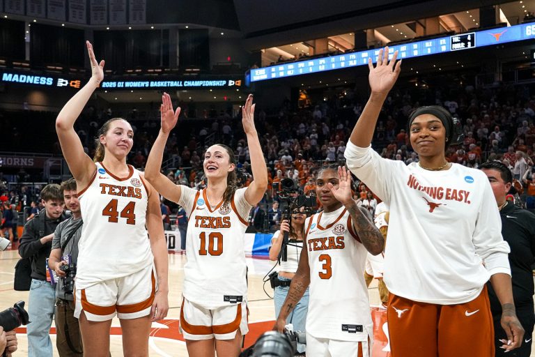 Texas Longhorns seniors Taylor Jones (44), Shay Holle (10), Rori Harmin (3), and Aaliyah Moore (23) wave to the crowd after the second round NCAA playoff game against Illinois