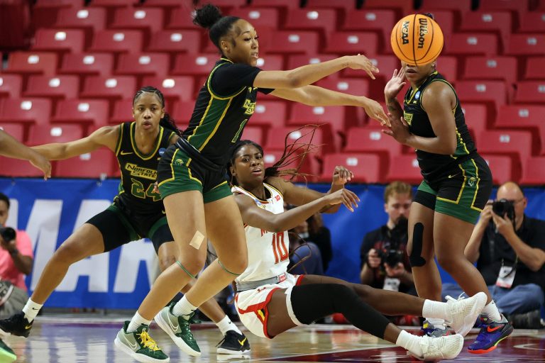 Maryland Terrapins guard Mir McLean (10) makes a pass past Norfolk State Spartans guard Da'Brya Clark (1) during the first half at Xfinity Center.