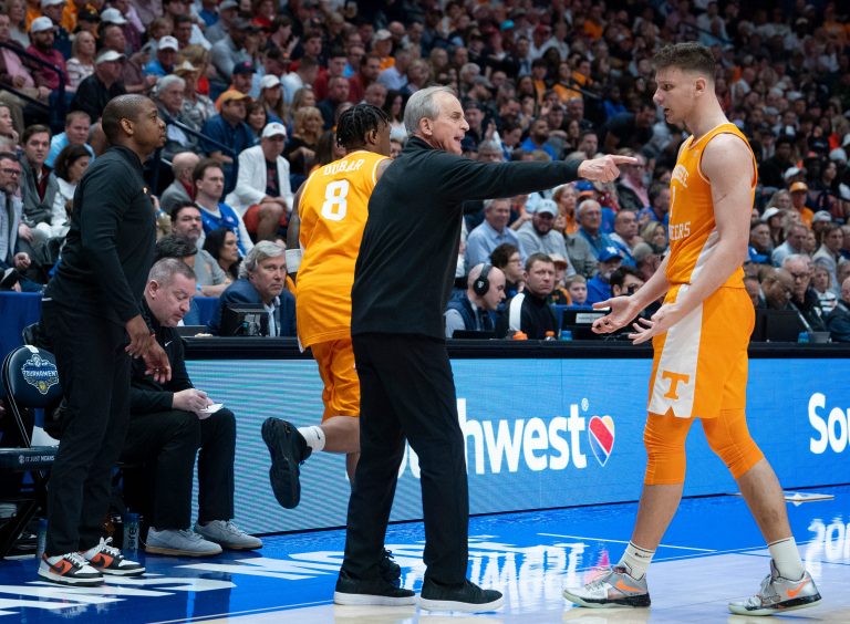 Tennessee head coach Rick Barnes discusses a play with Tennessee forward Igor Milicic Jr. (7) during the second half of their quarterfinal game of the SEC Men's Basketball Tournament against Auburn at Bridgestone Arena in Nashville, Tenn., Saturday, March 15, 2025.