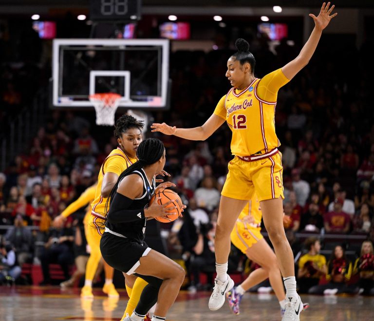 Mississippi State Bulldogs guard Eniya Russell (4) is double teamed by USC Trojans center Rayah Marshall (13) and USC Trojans guard JuJu Watkins (12) during an NCAA Tournament second round game at Galen Center.