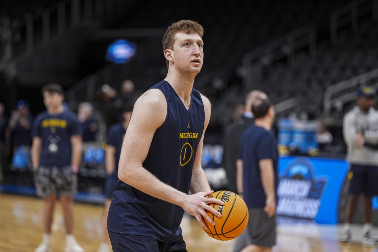 Michigan Wolverines center Danny Wolf (1) shoots on the court during practice at State Farm Arena.