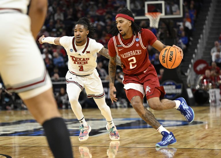 Arkansas Razorbacks guard Boogie Fland (2) drives to the hoop past Texas Tech Red Raiders guard Elijah Hawkins (3) during the first half during a West Regional semifinal of the 2025 NCAA tournament at Chase Center.