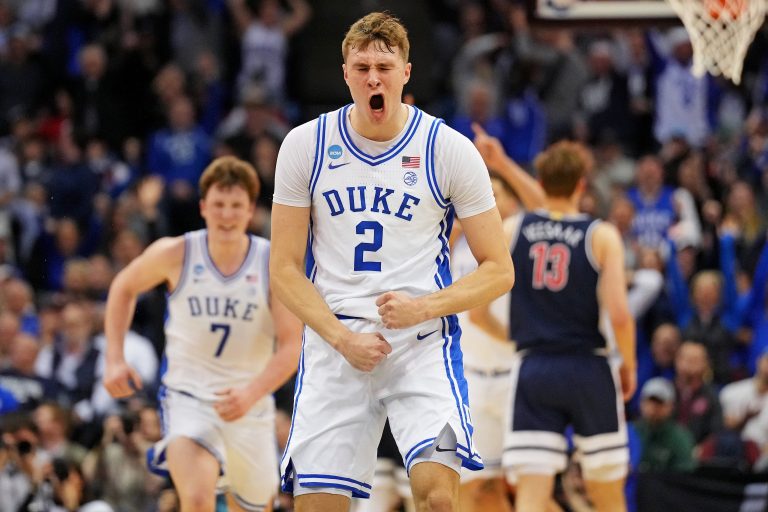 Duke Blue Devils forward Cooper Flagg (2) reacts after making a last second shot to end the first half against the Arizona Wildcats during an East Regional semifinal of the 2025 NCAA tournament at Prudential Center.
