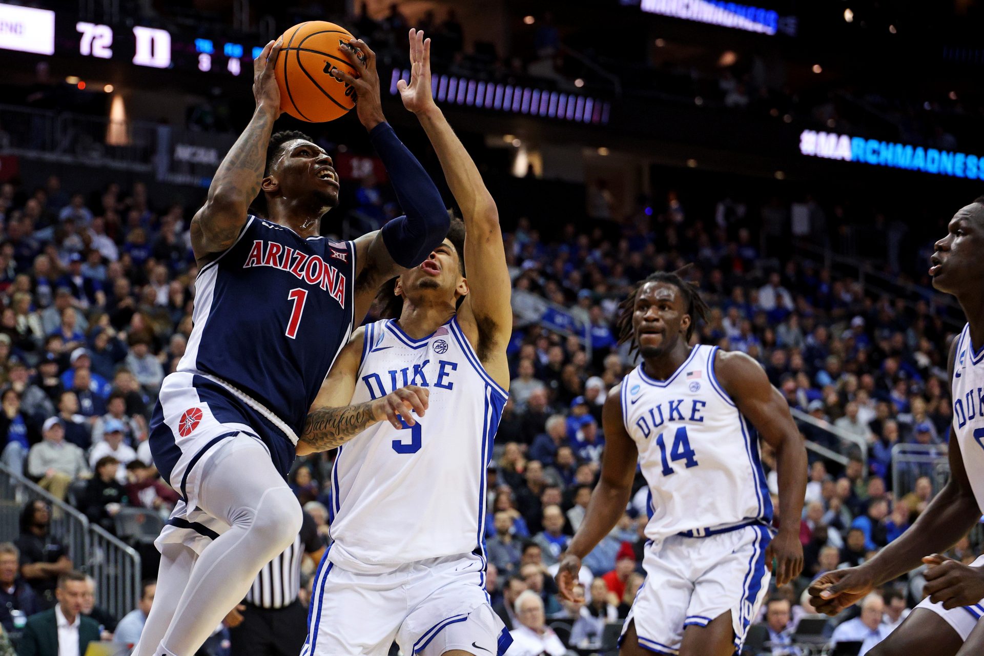 Arizona Wildcats guard Caleb Love (1) shoots the ball against Duke Blue Devils guard Tyrese Proctor (5) during the second half during an East Regional semifinal of the 2025 NCAA tournament at Prudential Center.