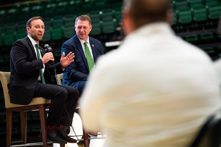CSU's new mens basketball coach Ali Farokhmanesh gives a speech during a press conference to introduce new CSU men's basketball coach