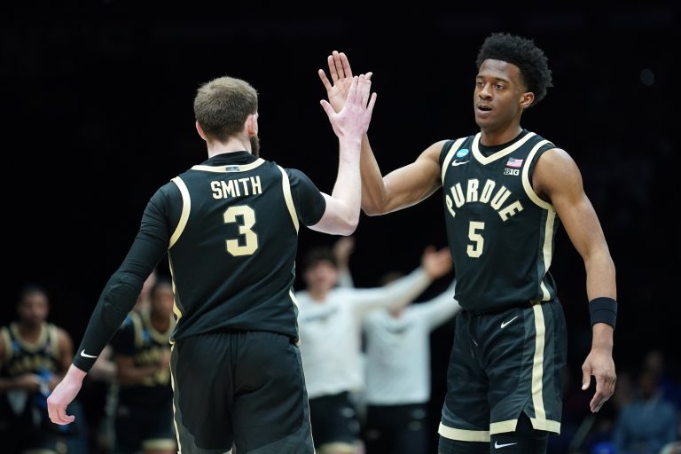Purdue Boilermakers guard Myles Colvin (5) and guard Braden Smith (3) react against the Houston Cougars in the second half during a Midwest Regional semifinal of the 2025 NCAA tournament at Lucas Oil Stadium.