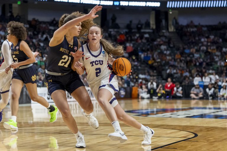 TCU Horned Frogs guard Madison Conner (2) works against Notre Dame Fighting Irish forward Maddy Westbeld (21) during the second half of a Sweet 16 NCAA Tournament basketball game at Legacy Arena.