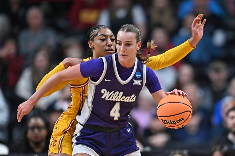 Kansas State Wildcats guard Serena Sundell (4) controls the ball against USC Trojans guard Kennedy Smith (11) during the first half of a Sweet 16 NCAA Tournament basketball game at Spokane Arena. at Spokane Arena.