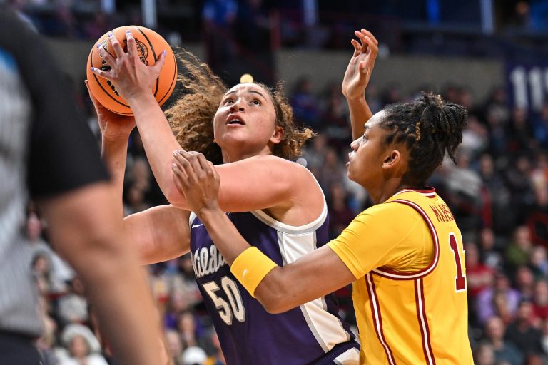 Kansas State Wildcats center Ayoka Lee (50) shoots against USC Trojans center Rayah Marshall (13) during the first half of a Sweet 16 NCAA Tournament basketball game at Spokane Arena. at Spokane Arena.