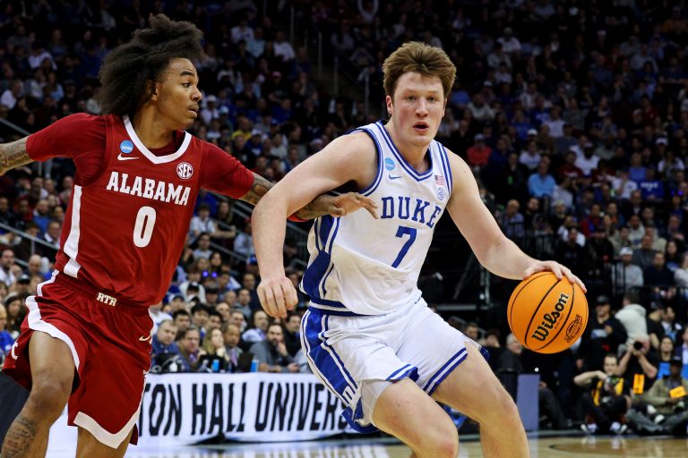 Duke Blue Devils guard Kon Knueppel (7) drives to the basket against Alabama Crimson Tide guard Labaron Philon (0) during the first half in the East Regional final of the 2025 NCAA tournament at Prudential Center.