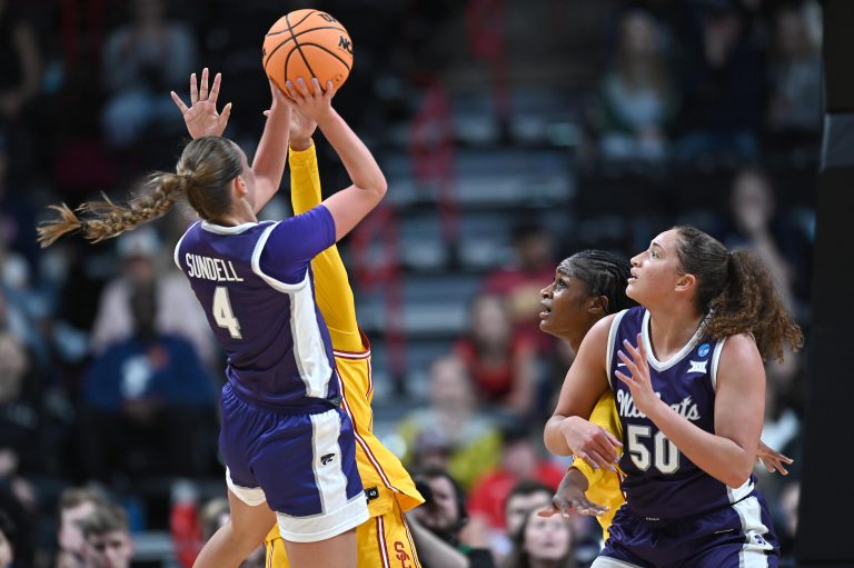 Kansas State Wildcats guard Serena Sundell (4) shoots against USC Trojans guard Kennedy Smith (11) during the second half of a Sweet 16 NCAA Tournament basketball game at Spokane Arena.
