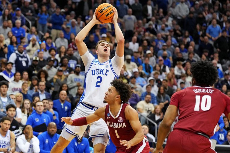 Duke Blue Devils forward Cooper Flagg (2) shoots the ball against Alabama Crimson Tide guard Mark Sears (1) during the second half in the East Regional final of the 2025 NCAA tournament