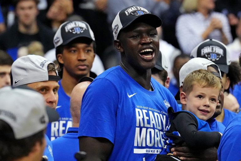 Duke Blue Devils center Khaman Maluach (9) cheers as the Duke Blue Devils cut down the nets after beating the Alabama Crimson Tide in the East Regional final of the 2025 NCAA tournament at Prudential Center.